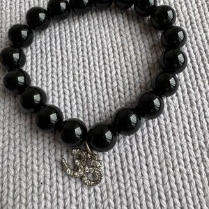Black Beaded Bracelet with Silver silver OM Charm